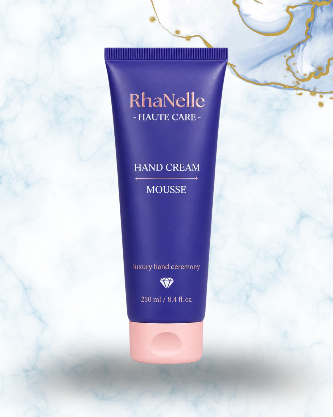Туба RhaNelle Hand Cream Mousse 250 мл върху светъл мраморен фон