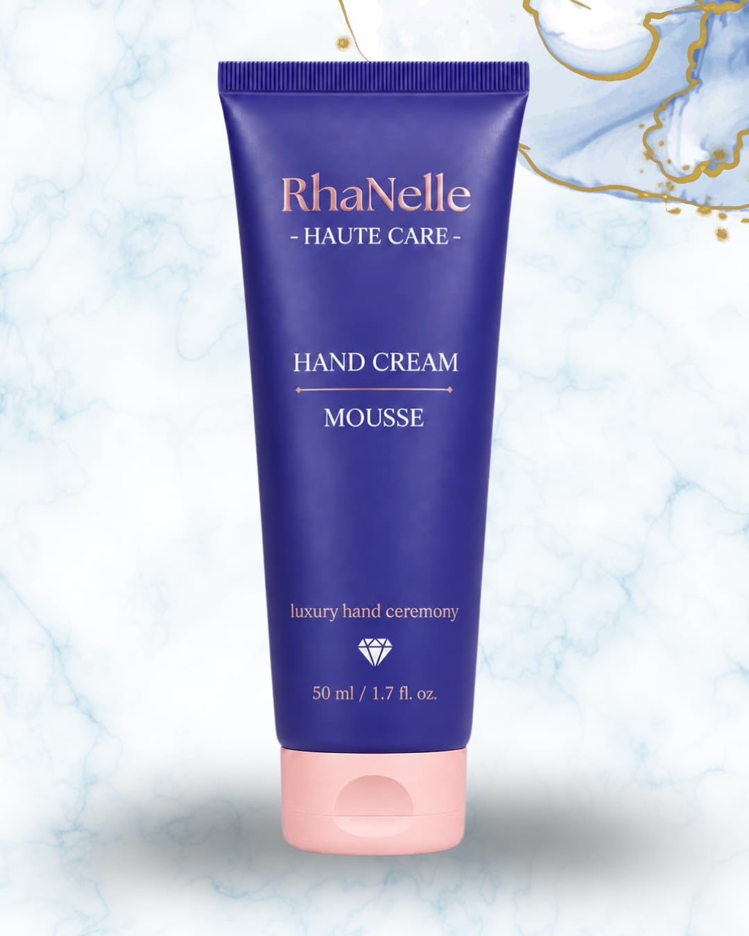 Туба RhaNelle Hand Cream Mousse 50 мл върху светъл мраморен фон